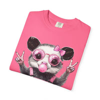Cute But Feral, Possum in Pink Bibs - Comfort Colors | Trendy Women's T-Shirt. Direct to Garment. Printed & Shipped in the USA. Unisex Sizes.