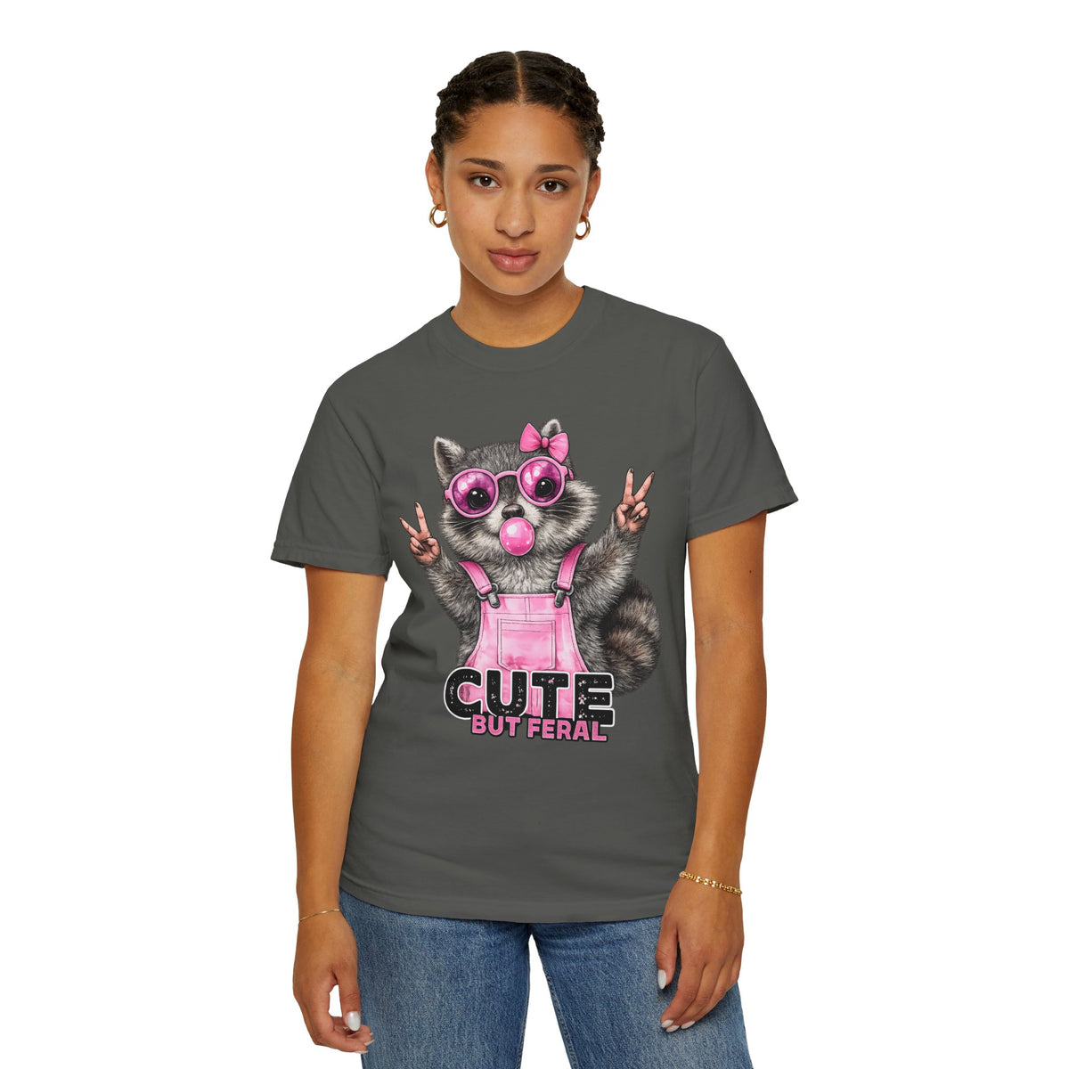 Cute But Feral, Raccoon in Pink Bibs - Comfort Colors | Trendy Women's T-Shirt. Direct to Garment. Printed & Shipped in the USA. Unisex Sizes.