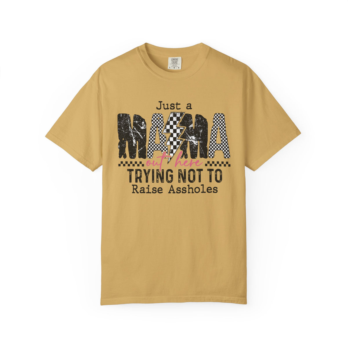 Just a Mama Out Here Trying Not To Raise Assholes - Comfort Colors | Trendy Women's T-Shirt. Direct to Garment. Printed & Shipped in the USA. Unisex Sizes.