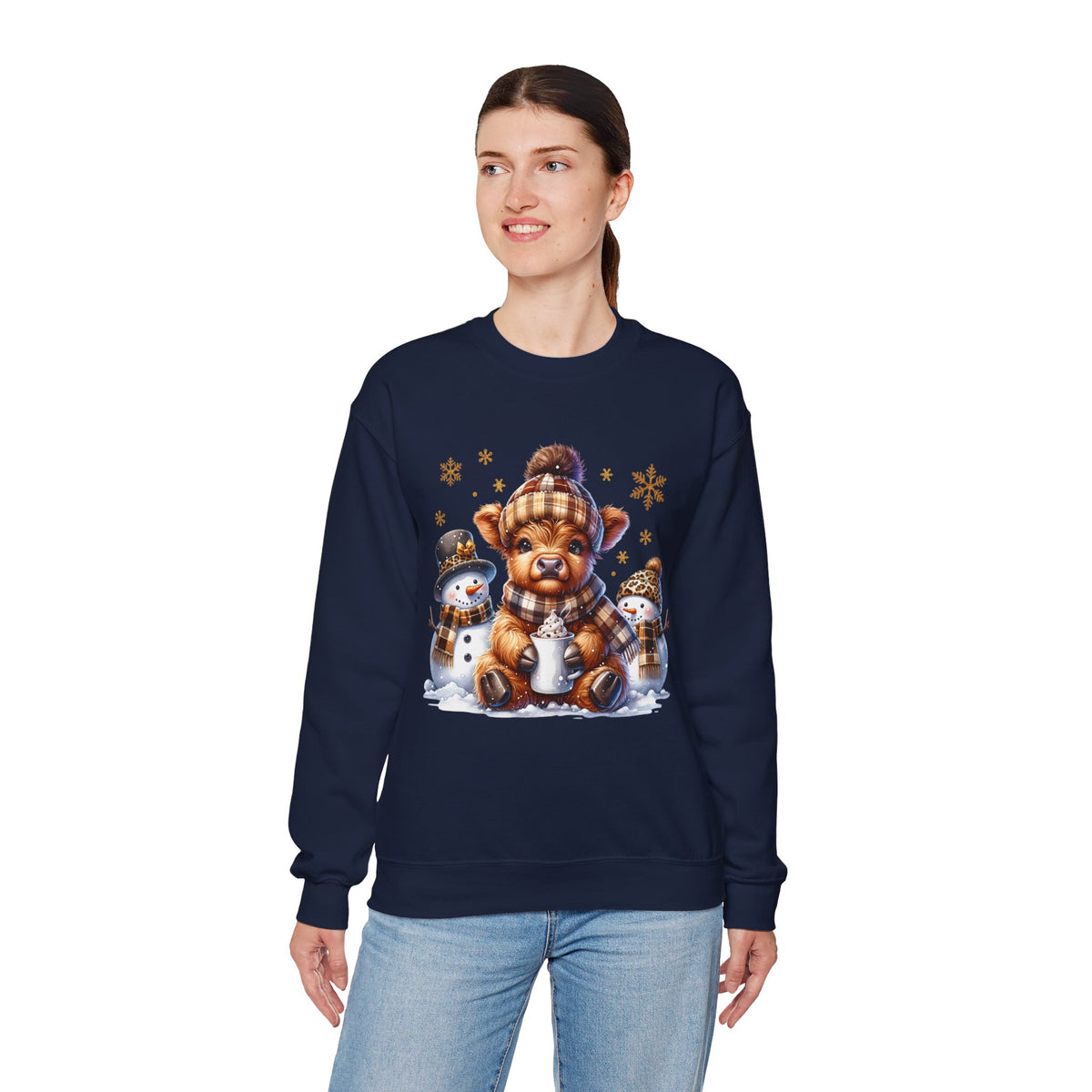 Cute Highland Cow with Snowmen, Winter – Gildan Heavy Blend | Trendy Women’s Soft Sweatshirt. Direct to Garment. Printed & Shipped in the USA. Unisex Sizes.