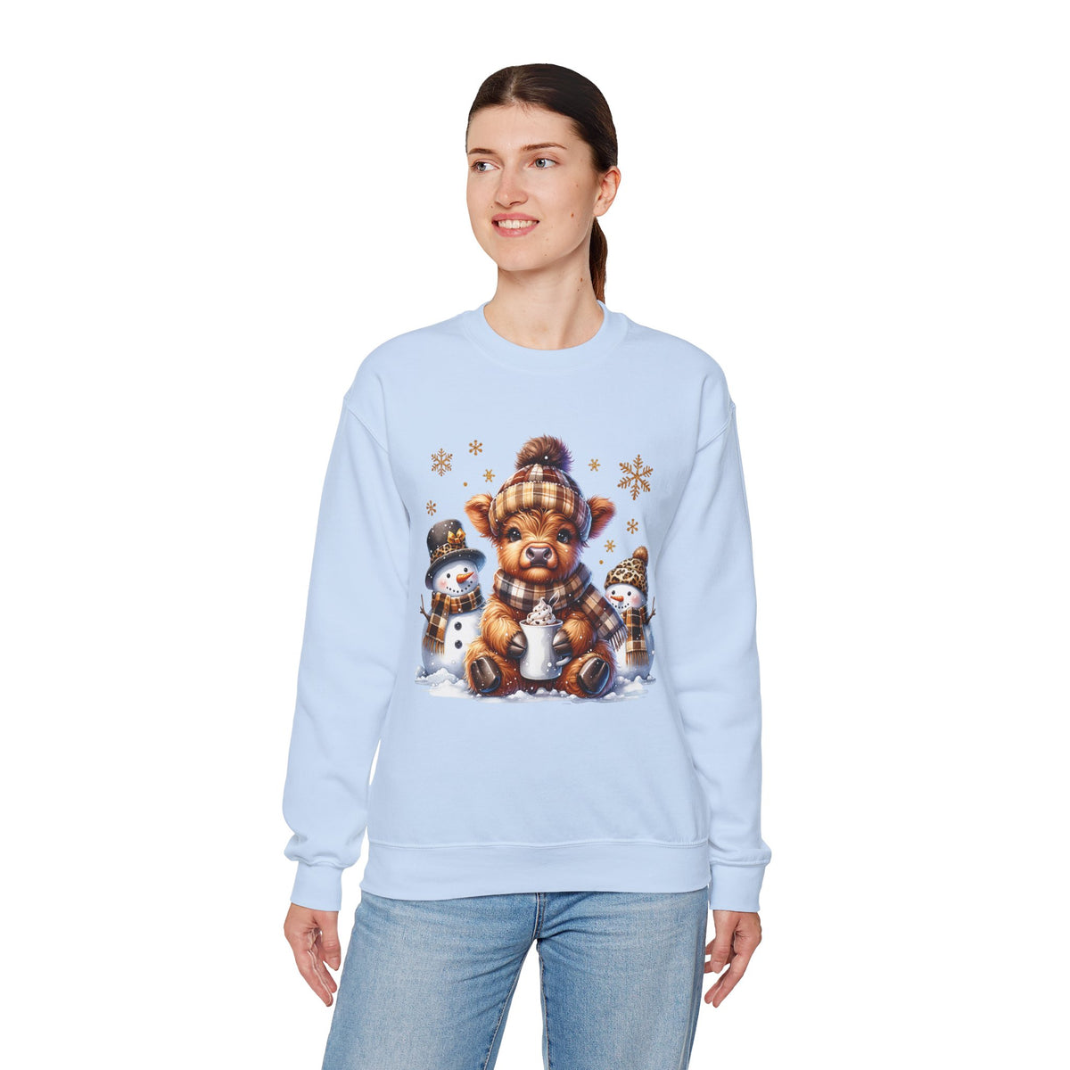Cute Highland Cow with Snowmen, Winter – Gildan Heavy Blend | Trendy Women’s Soft Sweatshirt. Direct to Garment. Printed & Shipped in the USA. Unisex Sizes.