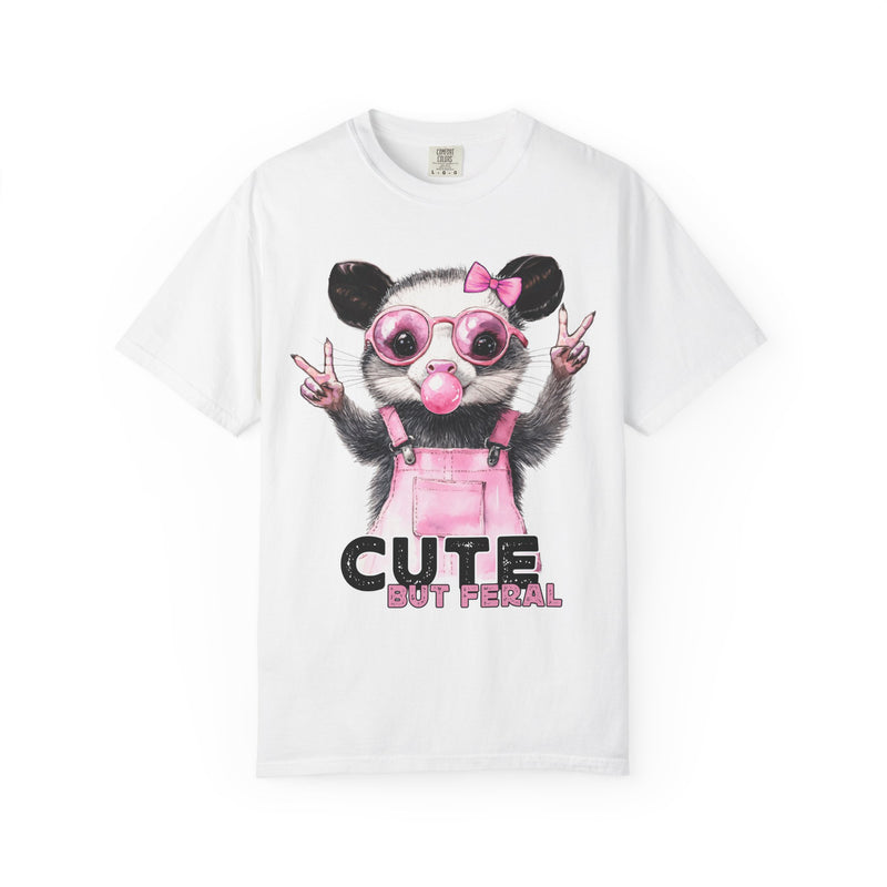 Cute But Feral, Possum in Pink Bibs - Comfort Colors | Trendy Women's T-Shirt. Direct to Garment. Printed & Shipped in the USA. Unisex Sizes.