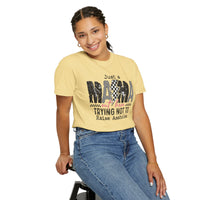 Just a Mama Out Here Trying Not To Raise Assholes - Comfort Colors | Trendy Women's T-Shirt. Direct to Garment. Printed & Shipped in the USA. Unisex Sizes.