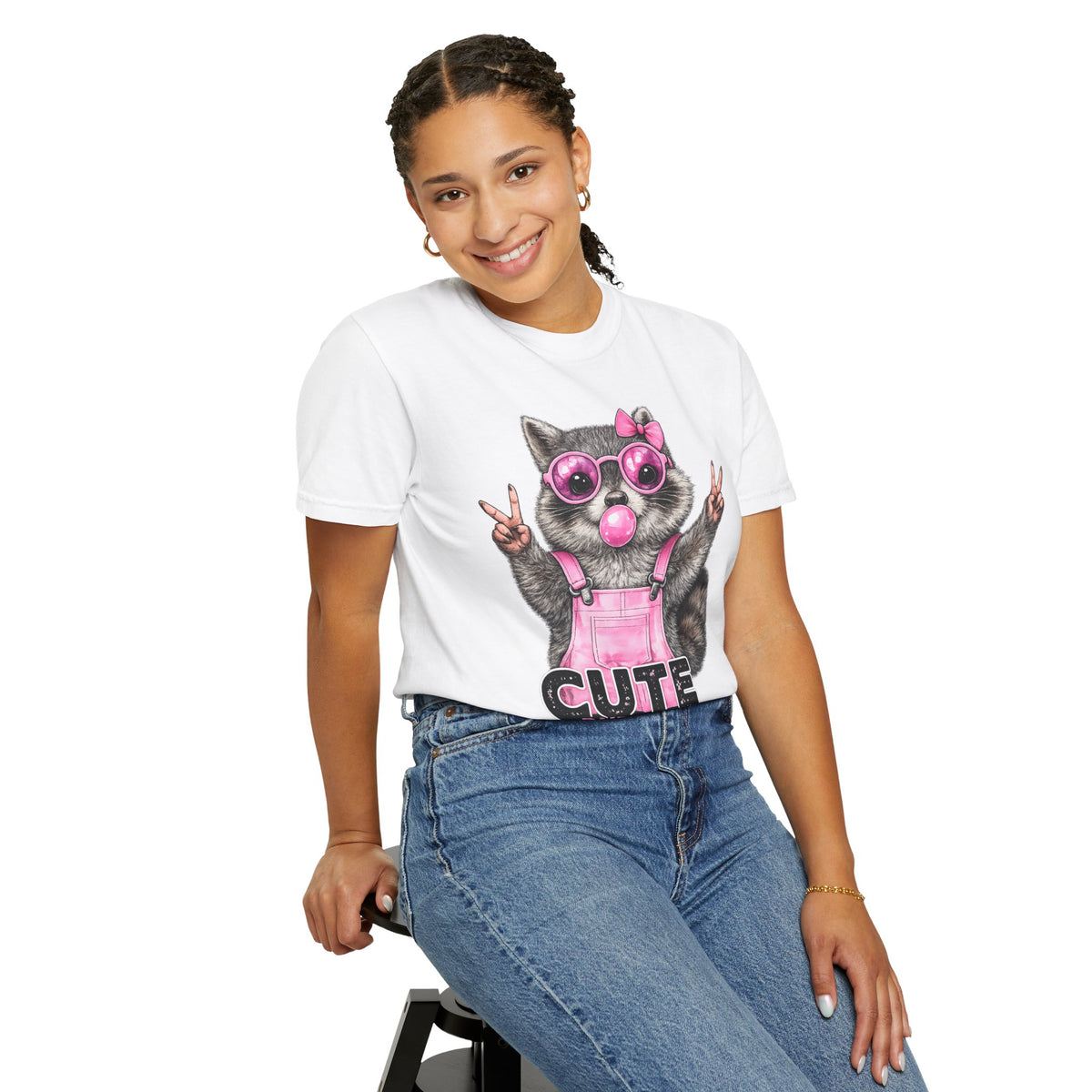 Cute But Feral, Raccoon in Pink Bibs - Comfort Colors | Trendy Women's T-Shirt. Direct to Garment. Printed & Shipped in the USA. Unisex Sizes.