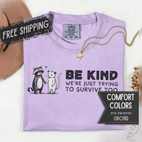 Be Kind We're Just Trying To Survive Too - Possum Raccoon *This Shirt Saves Lives* - Comfort Colors | Trendy Unisex T-Shirt. Direct to Garment. Printed & Shipped in the USA. Unisex Sizes.
