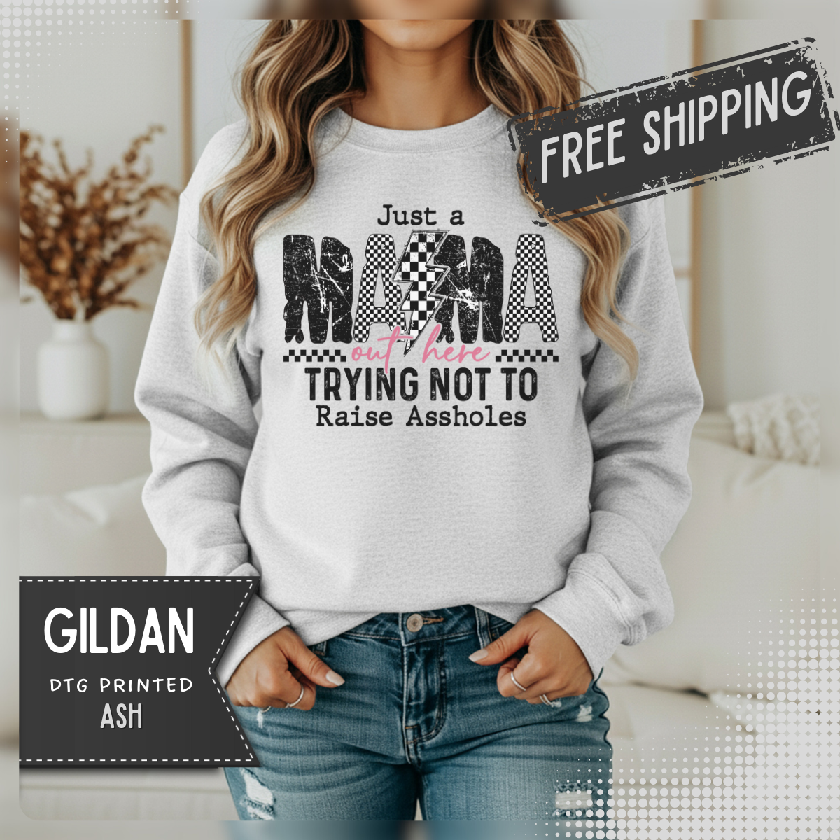 Just a Mama Out Here Trying Not To Raise Assholes – Gildan Heavy Blend | Trendy Women’s Soft Sweatshirt. Direct to Garment. Printed & Shipped in the USA. Unisex Sizes.