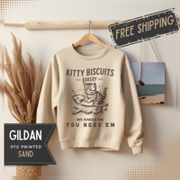 Kitty Biscuits Bakery – Gildan Heavy Blend | Trendy Women’s and Men's Soft Sweatshirt. Direct to Garment. Printed & Shipped in the USA. Unisex Sizes.