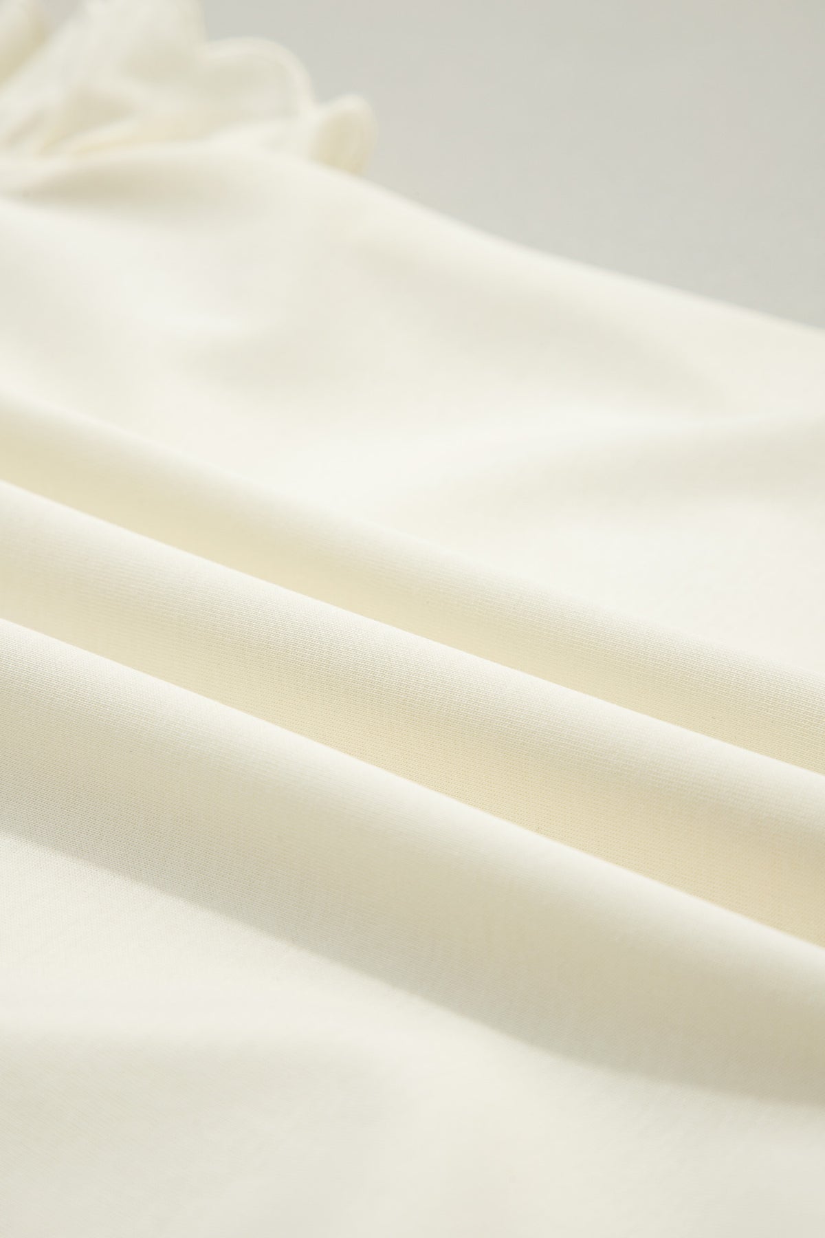 Soft Cream Partial-Zip Top with Ruffled Sleeves