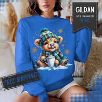 Winter Baby Highland Cow with Cocoa – Gildan Heavy Blend | Trendy Women’s Soft Sweatshirt. Direct to Garment. Printed & Shipped in the USA. Unisex Sizes.